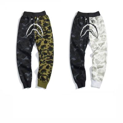 China 2023 New Anti-wrinkle BAPE Winter Pants Black And White Shark Mouth Print Camouflage Splicing Fashion Loose Couple Pure Cotton Pants for sale