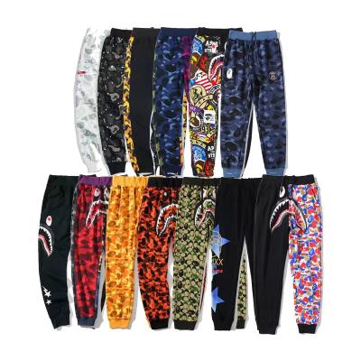 China 2023 Anti-Wrinkle Best Selling BAPE Pants Solid Shark Mouth Print Men And Women Cargo Multi-pocket Outdoor Pants for sale