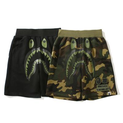 China CIA BAPE Shark Breathable Hot Shorts Black And Green Mouth Printed Monkey Head Letter Stripe Fashion Men And Women Loose Shorts for sale