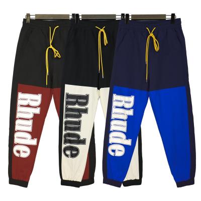 China High Street Fashion American Fashion Waterproof Logo Alphabet Print Splice Contrast Hip Hop RHUDE Tunic Casual Woven Pants for sale