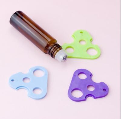 China Triangle Plastic Roller Bottle Opener Multifunctional Lid Opening Stored Auxiliary Dispensing Tool for sale