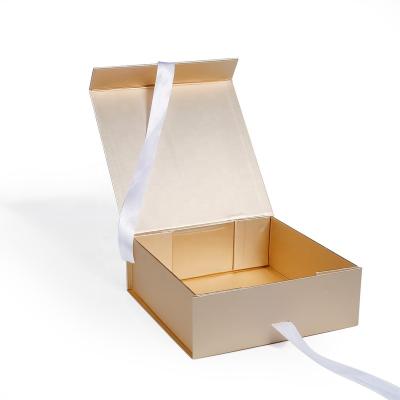 China Recycled Materials 2022 Champagne Gold Packaging Foldable Boxes With Ribbon Shipping Cardboard Custom Gift Packaging Paper Boxes With Custom Logo for sale