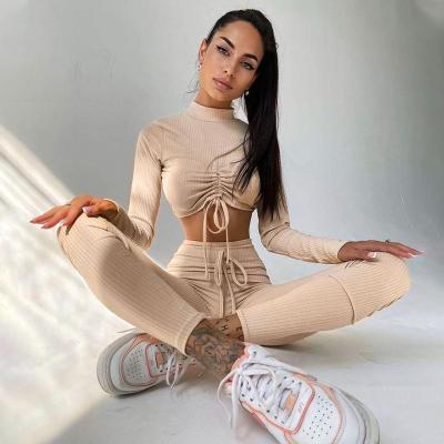 China 2021 New Breathable Autumn Solid Color Long Sleeve Pants Ruffle Tied Rope Yoga Set Crop Two Pieces Sports Sets for sale