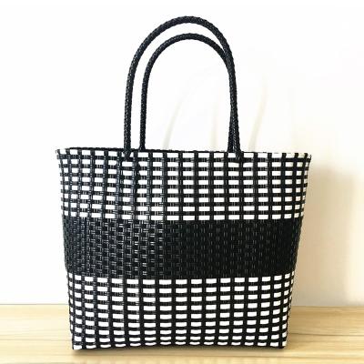 China 100% Eco-friendly White And Black Geometric Handmade Colorful PP Tie Woven Women Recycled Plastic Bag for sale