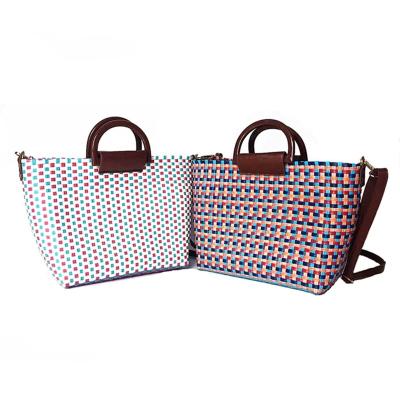 China Recyclable Handmade Hollow Woven PE Recycled Packaging Plastic Straps Straw Bag for sale