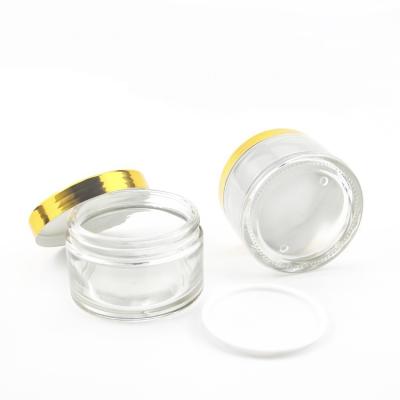 China The round bottom of personal care transparent empty glass cosmetic bottle with luxury cream gold cap jar 200ml for sale