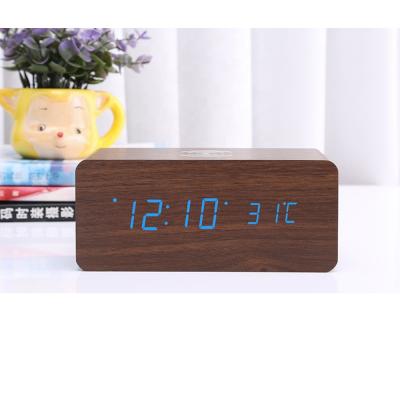 China Class 2019 hot product MDF table led wooden clock digital table clock with wireless rechargeable for sale