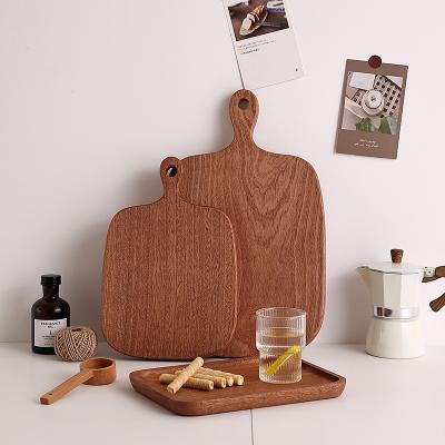 China Eco-friendly wooden pizza board, ebony sapele wood cutting board with handle, wholesale price durable solid wood boards for sale