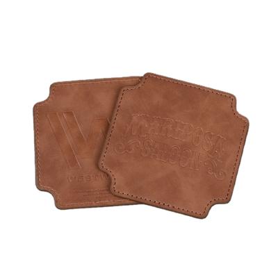 China Viable Wholesale Blank Genuine Leather Cup Coaster Embossed Custom Logo Square Fashion Leather Coffee Drinks Mat for sale