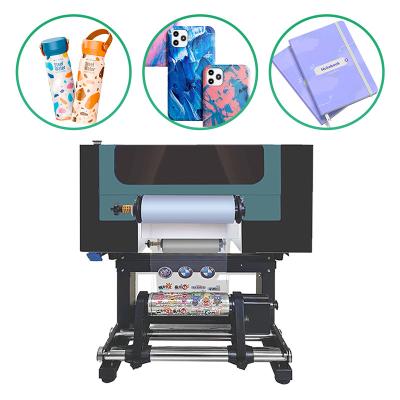 China Impresora UV de doble cabeza I3200 Impresora de pegatinas UV Dtf de rollo a rollo con laminador en venta