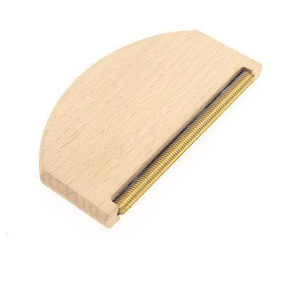 China Manual Profitable Gold Comb Pilling Teeth Sweater Removing Cashmere Wood Comb for sale