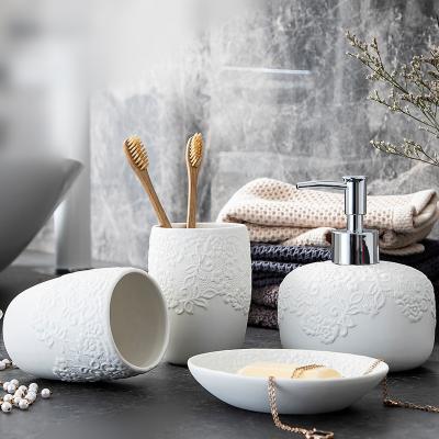 China Creative Embossed Ceramic 4 Piece Bathroom Accessories Set White Sustainable Modern Bathroom Accessory for sale