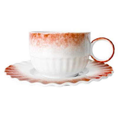 China Sustainable Coffee shop cappuccino latte unique shape glazed ring handle ceramic cups with saucer for sale