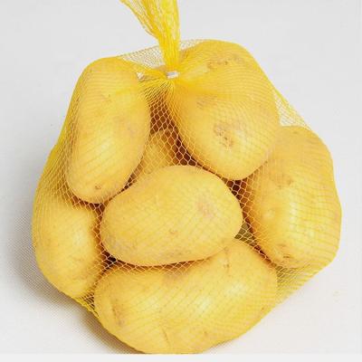 China Biodegradable Pure Yellow Plastic Food Bag 100% Reusable Pe Mesh Bag Roll Potato Bag for sale