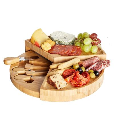 China Sustainable Available Wholesale Round Cheese Bamboo Cutting Board Safe Sample Multi-space for sale