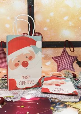 China Foldable Kraft Paper Packaging Bags With Fancy Christmas Santa Picture for sale