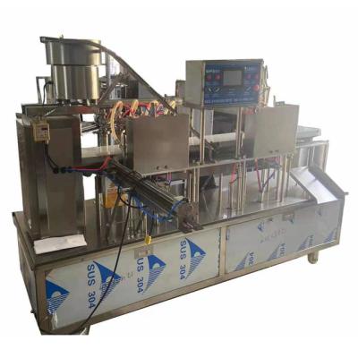 China Milk Up Pouch Packing Machine Four Spout Filling Capping Rack With Cap Liquor /red Wine Spout Pouch Filling Packing Machine for sale