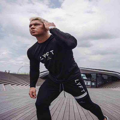 China Breathable Breathable Loose Round Neck Sleeves Long Long Sleeve Sport Compression Men Fitness Clothing Top for sale