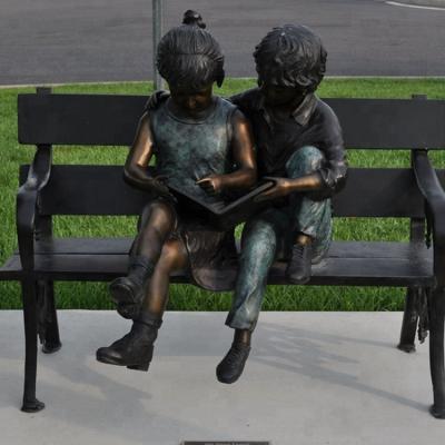 China China Outdoor Large Garden Decorative Bronze Material Boy And Girl On A Bench Garden Statue for sale