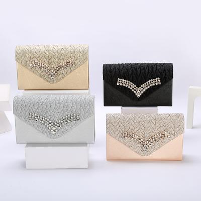 China Magnetic Buckle WAKED UP Factory Direct Selling Rhinestone Shiny Envelope Magnetic Buckle Evening Clutch Bags For Women for sale