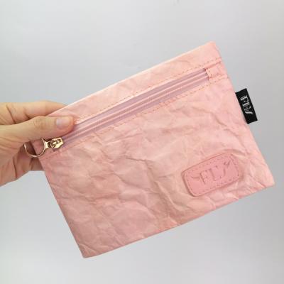 China Dupot Eco-friendly Paper Pink Cosmetic Bag Makeup Bag Travel Women Make Up Bag for sale