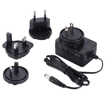 China Interchangeable Power 100-240V, 50-60Hz 0.5A AC 12w DC Power Charger PC+ABS Fire Plug Adapter for sale