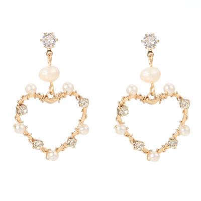 China CLASSIC Luxury Rhinestone Pearl Inlaid Resin Stud Earrings Heart Shape Geometric Alloy Fashion Earrings For Women for sale