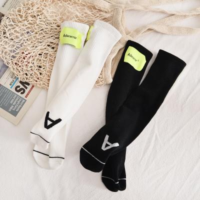 China Antibacterial Custom Fashion New Cotton Children's Calf Socks Breathable Solid Color Kids Black And White Socks for sale