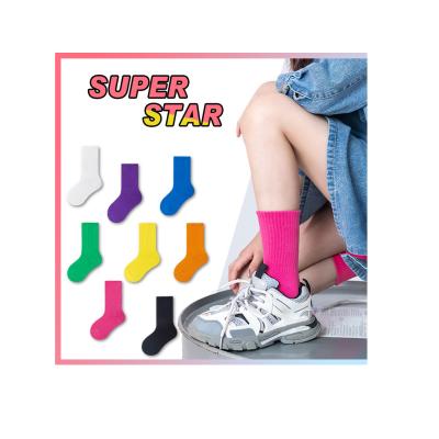 China Europe and America custom made children's mid student solid color fashionable socks antibacterial non-slip breathable tube socks for sale