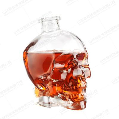 China Beverage whiskey glass wine glass bottles vodka skull shape1000ml glass bottle with cork for sale