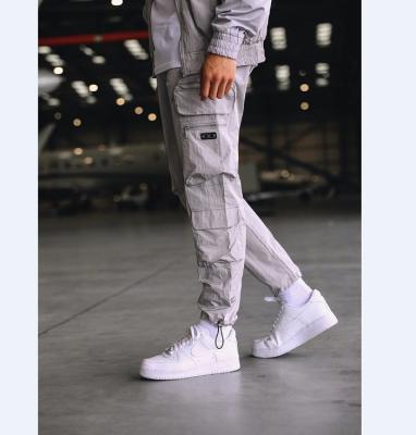 China Anti-Static Customize Mens Woven Conflict Cargo Slim Fit Combat Pants With Nylon Shiny Fabric for sale