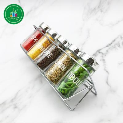 China Freshness Preservation 100ML Round Glass Spices Jar With Metal Rack for sale