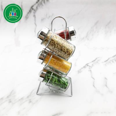 China Sustainable 100ml Round Glass Spices Jar With Metal Rack for sale