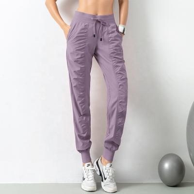 China Breathable OEM Pleated Integral Joggers Closed Bottom Comfortable Workout Lounge Pants With Pockets for sale