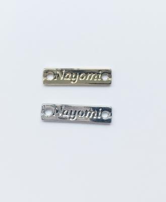 China Custom Logo Metal Label For Swimwear Underwear Elegant Light Gold Metal Tags for sale