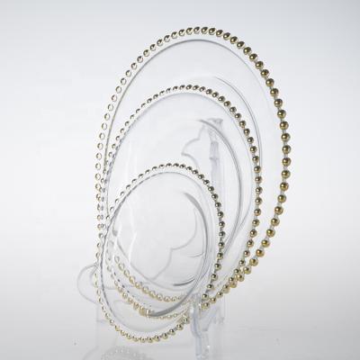 China Wholesale Disposable Fashionable Clear Gold Rim Beaded Glass Charger Dish For Wedding And Engagement for sale