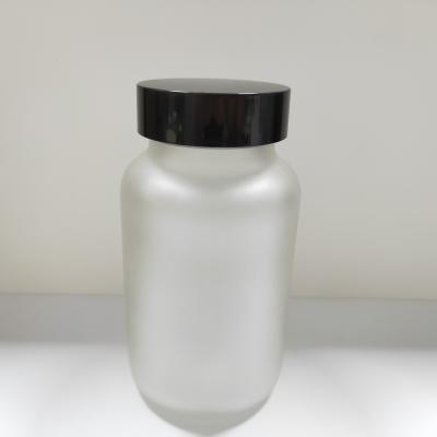 China Personal Care 100ml 150ml 200ml250ml round frosted label matte clear empty silkscreen lacquer hot stamping lid black cap glass bottle for sale