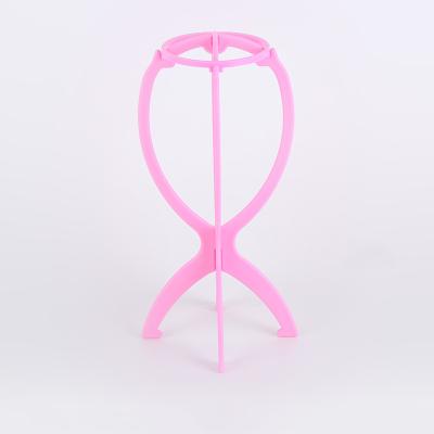 China 2021 modern new arrived plastic wig stand high quality custom made pink fashion wig stand for sale