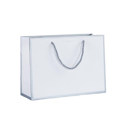 China Recycled Materials Personalized Gift Bag Custom Logo White Kraft Paper Bags With Handles for sale