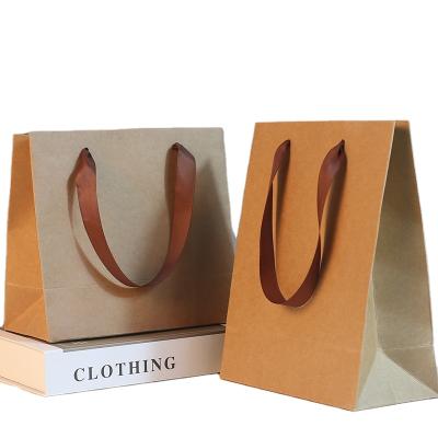 China Recycled Materials Wholesale Blue Shoes Clothes Kraft Paper Bags Printed Logo Shopping Gift Paper Bag Custom Made for sale