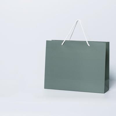 China Recycled Materials Kraft Paper Bag With Handle And Black Gift Bags Custom Logo for sale