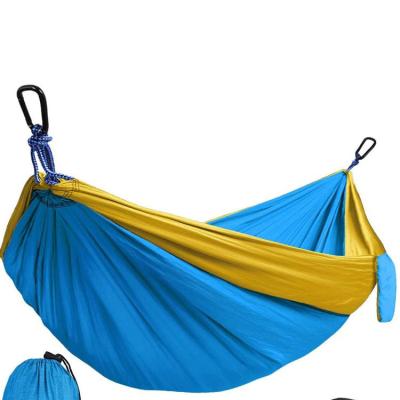 China Durable Outdoor Portable Canvas Camping Swing Hammock Folding Rainbow Stripe Water Hammock for sale