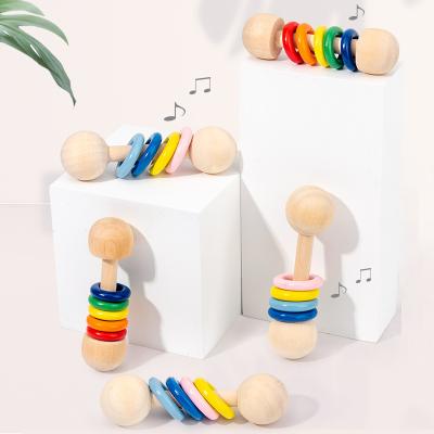 China Musical Toy New Toddlers Natural Safety Montessori Painting Grabbing Teething Rainbow Teether Wooden Rattle Toys Baby for sale