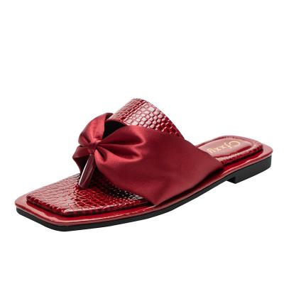 China Women's Bowknot Ribbon Fashion Summer Slippers Antiskid Flat Bottom Slippers Artificial Rubber Red PU Slides Flat Heel Sandals Slippers for sale