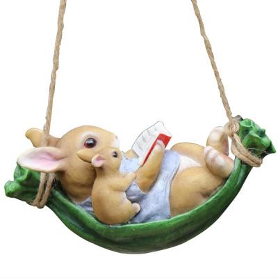 China Europe Garden Balcony Decoration Outdoor Resin Open Ornaments Creative Animal Tree Hanging Cute Rabbit Carving Hammock for sale