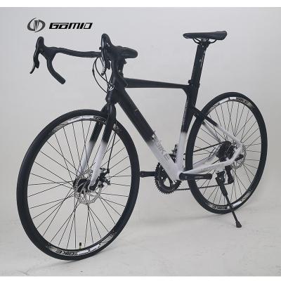 China Ciclo de engrenagem de fibra de carbono simulado com hubs de rolamento selados de libertação rápida GOMID Bicicleta de corrida 700c Bicicleta de estrada à venda