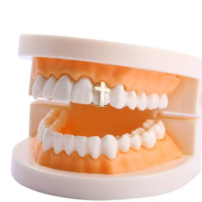 China New Simple Brass Hiphop Jewelry Single Cross Hip Hop Teeth Grillz Striker Gold Plated Dental Grillz for sale