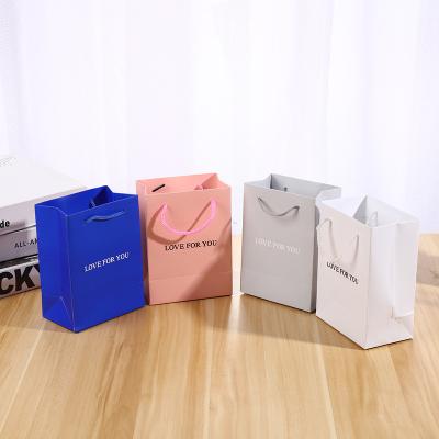 China Recycled Materials Shopping Packaging Customized Printed Paper Gift Bags With Design Logo Paper Pouch Packaging Velvet Jewelry Gift Bag Wholesale for sale