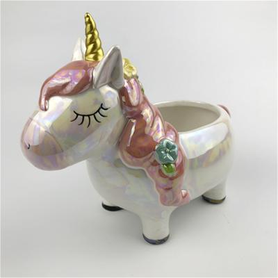 China Sustainable White Unicorn Shaped Hand Painted Ceramic Cookie Jar Candy Storage Jar for sale