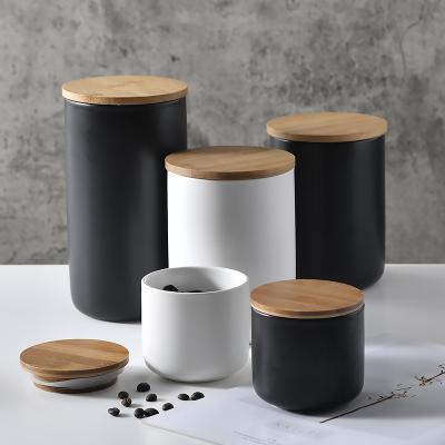 China Custom Europe Nordic White Black Porcelain Ceramic Tea Coffee Sugar Canister Sealed Jars Storage Jars Bottles With Bamboo Lid for sale